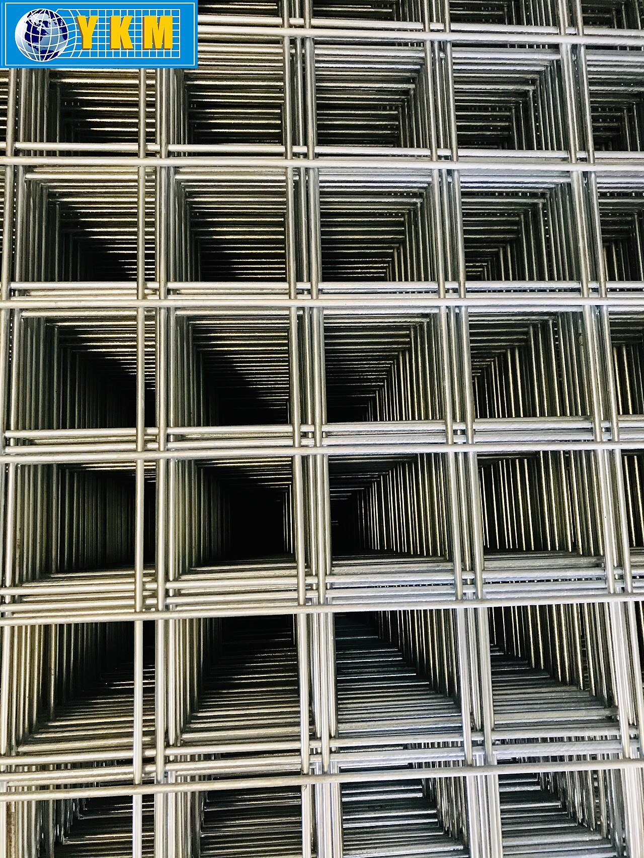 Galvanized welded wire mesh panel showing rigid welded intersections used in predator fencing