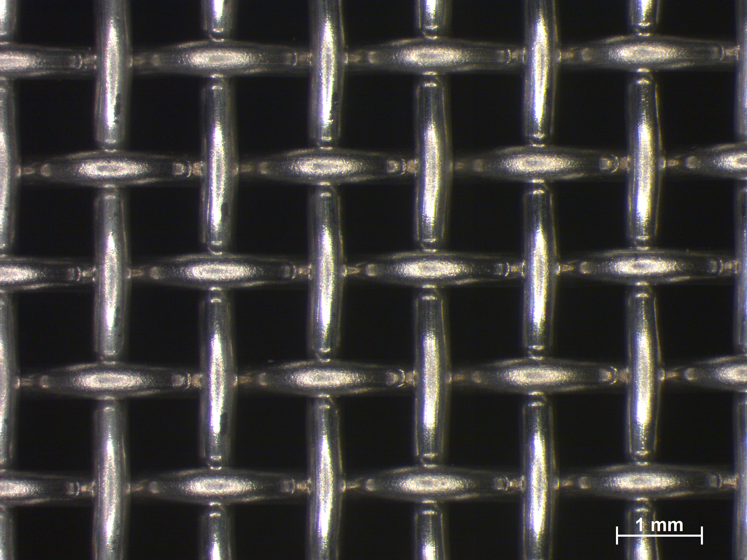 Close-up of square woven wire mesh similar to hardware cloth used on chicken coops